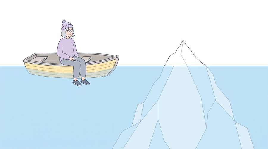 Aino sits in a small rowing boat looking at the small tip of an iceberg. Under the water, the much bigger part of the iceberg spreads out.